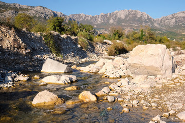 Landscape with the image of mountain stream
