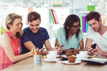 Fototapeta premium Creative team working together on a tablets and smartphones