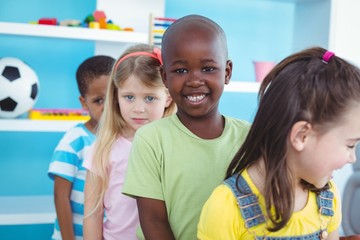 Happy kids standing in a line