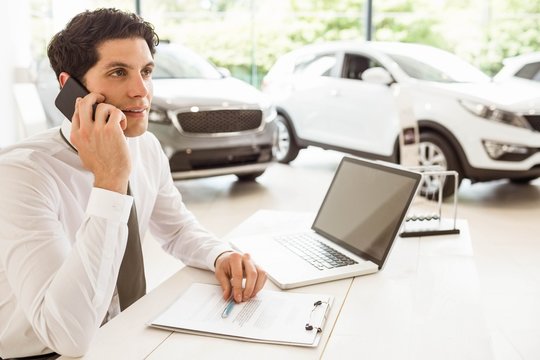 Smiling Salesman Having A Phone Call