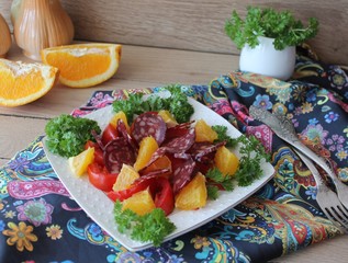 salad with tomatoes, orange and chorizo