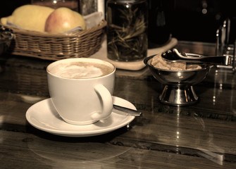 cup of coffee and a bowl of sugar