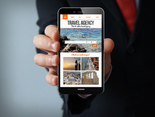travel agency website on screen businessman smartphone