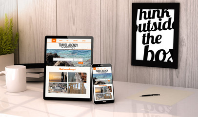 desktop tablet and phone travel agency website on screen