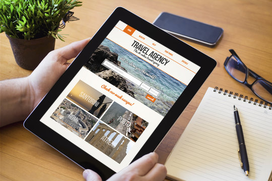desktop tablet travel agency website on screen
