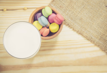French macaroons on sack with wood background on filter color , breakfast