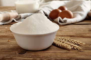 flour in a bowl with a slide close up