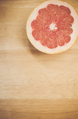 autumnal fruits still life - half cut pink grapefruit