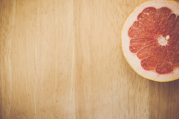 autumnal fruits still life - half cut pink grapefruit