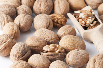 pile of walnuts in the foreground represent a healthy diet
