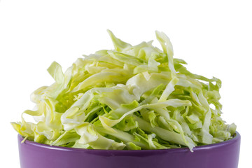 sliced cabbage in purple bowl