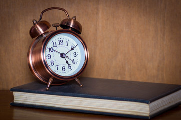 Alarm clock and book.