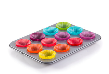 muffins baking tray with colourful paper cases
