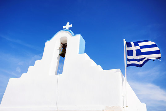 Cycladic church with greek flag, Greece