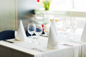 close up of table setting with glasses and cutlery