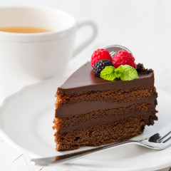 Chocolate cake on white plate