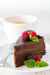 Chocolate cake on white plate