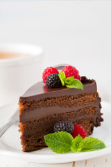 Chocolate cake on white plate