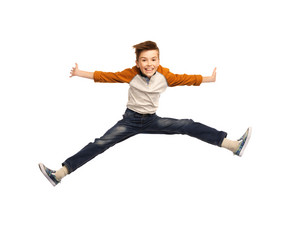 happy smiling boy jumping in air