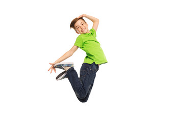 smiling boy jumping in air