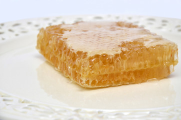 Picturesque honeycomb on porcelain plate