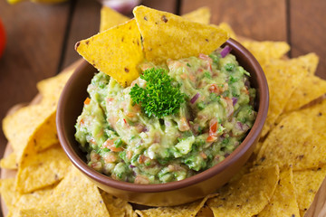 Guacamole avocado, lime, tomato, onion and cilantro, served with nachos - Traditional Mexican snack