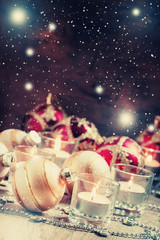 Christmas or New Year card with golden Christmas balls, candles