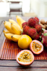Assortment of tropical exotic fruits: dragonfruit, bananas, passion , longan, rambutan 