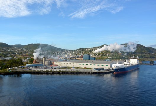 view from the ocean towards the western shoreline of Corner Brook, Newfoundland, Canada; harbour and city