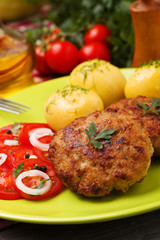 Fresh, homemade meatballs, served with tomato salad and new pota