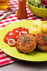 Fresh, homemade meatballs, served with tomato salad and new pota