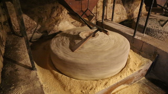 Millstone in water mill grinds corn 7 of 7