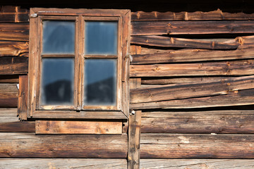 Rough Wood Wall of Summer Shepherds Hut with Window, fabulous timber texture