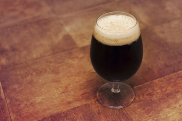 dark beer on the table, glass