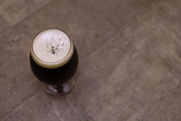 dark beer on the table, glass