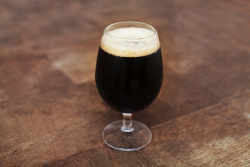 dark beer on the table, glass