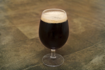 dark beer on the table, glass