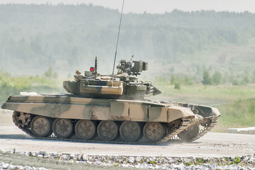 Tank T-80s in motion