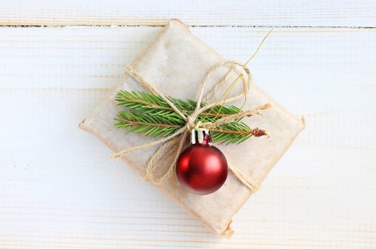 Handmade Cute New Year Gift Wrapped Parchment Paper Decoration Fir Twigs Twine Christmas Tree Decor, Wooden Surface