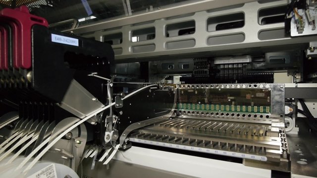 SMT mounter (machine) with SMD components in work