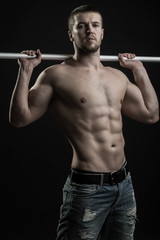 Muscular man with crossbar