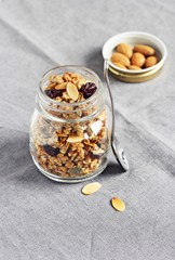 Granola with nuts,seed mix and dried cranberries. Selective focus, toned image 