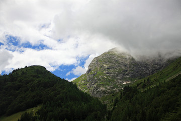 Fototapeta na wymiar Hills in the clouds, Alps, Austria.
