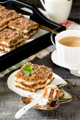 Cottage cheese and chocolate cake on a dark wooden table