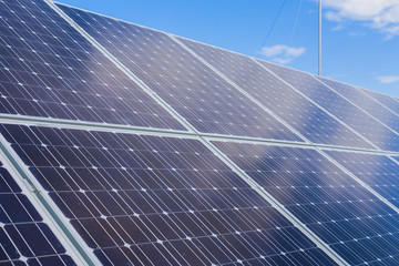 Solar panels against the sky and clouds. Photovoltaics.
