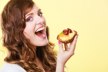 Closeup woman eating fruit cake sweet food