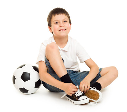 soccer boy with ball studio isolated white background