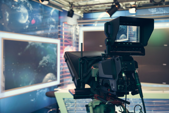 Television studio with camera and lights - recording TV NEWS