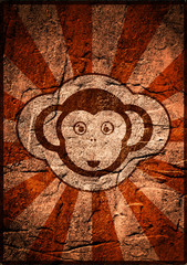 monkey face icon on sun burst concrete backdrop