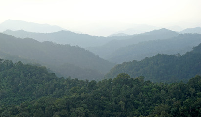 misty mountain hills landscape, layers of mountains with fog
